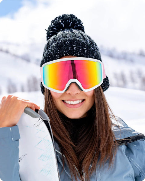 Woman wearing OTG Ski Goggles With Anti Fog Lenses And UV Protection Dual Venting Red White, smiling on snowy slope.