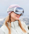 Woman wearing Ski Goggles OTG For Men And Women Interchangeable Magnetic Lenses UV Protection in snowy mountain setting
