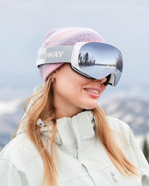 Woman wearing Ski Goggles OTG For Men And Women Interchangeable Magnetic Lenses UV Protection in snowy mountain setting