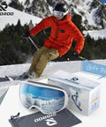 Ski goggles with wide vision, OTG design, and anti-fog UV protection next to skier on snowy slope