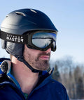 Man wearing OTG Ski Goggles Over Glasses For Men Women Youth Anti Fog UV Protection Lens with helmet in snowy area