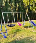 Outdoor playground swing set with slide and seats on grassy lawn