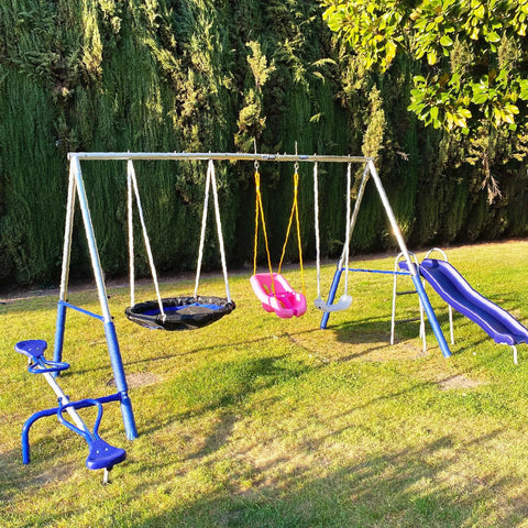 Outdoor playground swing set with slide and seats on grassy lawn