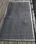Outdoor Rubber Floor Mat With Drainage Holes Anti Slip Heavy Duty Entrance Mat for wet areas, shown outdoors on wood deck.