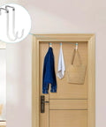 Over-door hooks with hanging clothes and bag showcasing storage solution.