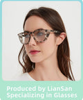 Woman wearing oversized tortoiseshell glasses, front view.