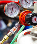 Close-up of an Oxy-Fuel Quick Connect Regulator To Hose Coupler Set For Fuel And Oxygen connected to a gas cylinder.