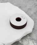 Two Pieces P1.0mm Straight Knurling Wheels, 28x8x8mm Steel Roller on stone surface
