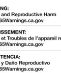 Warning label for cancer and reproductive harm in English, French, and Spanish with website link to P65Warnings.ca.gov