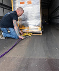 Man using Heavy Duty Double Scissor Pallet Puller For Easy Pallet Moving, 4 Inch Jaw Opening, 5000 Lb Capacity on truck floor