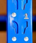 Close-up of blue pallet rack with Pallet Rack Drop Pins 100 Pcs M5x5mm J Bolt Safety Clips Cross Beam Lock Pins For Warehouse And Home installed