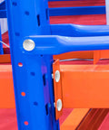Close-up of installed Pallet Rack Drop Pins 100 Pcs M5x5mm J Bolt Safety Clips securing blue and orange warehouse rack beams.