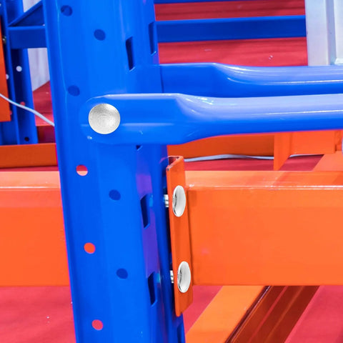 Close-up of installed Pallet Rack Drop Pins 100 Pcs M5x5mm J Bolt Safety Clips securing blue and orange warehouse rack beams.