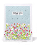 Greeting card with pink flowers and a quilted blue background, featuring a 'sending you a paper hug' message.