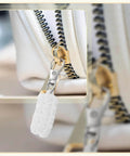Close-up of Paracord Zipper Pulls 80mm Polyester Replacement With Metal Clasp 6 Pack Dark Blue on a white zipper.