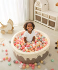 Child playing in ball pit with Ball Pit Balls,Plastics Balls for Ball Pit, Stars Hearts Shape for PastelBall for Toddlers Kids，6 Mix Colors,50pcs