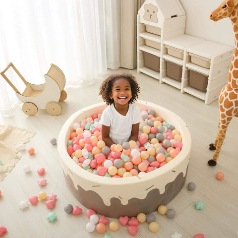 Child playing in ball pit with Ball Pit Balls,Plastics Balls for Ball Pit, Stars Hearts Shape for PastelBall for Toddlers Kids，6 Mix Colors,50pcs