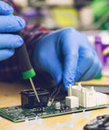 Hands installing 100 Pack Nylon PCB Standoffs With Reverse Locking Snap In Design, Non Conductive Spacers for DIY electronics
