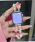 Hand holding smartwatch with decorative bead strap, featuring silver alloy adapters for seamless band swaps and style options.