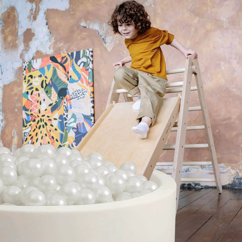 Kid sliding into ball pit filled with pearl white plastic balls, Ball Pit Balls 100 Play Balls Plastic Balls for Baby Girls Toddlers Kids.
