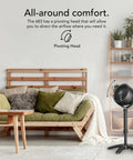 Room interior with an All Day Chill Pedestal Fan With Three Speed Control And Height Adjustable From 32 To 38 Inches Delivers Whole Room Air Circulation And Quiet Operation For Bedroom And Home By Vornado next to a couch.