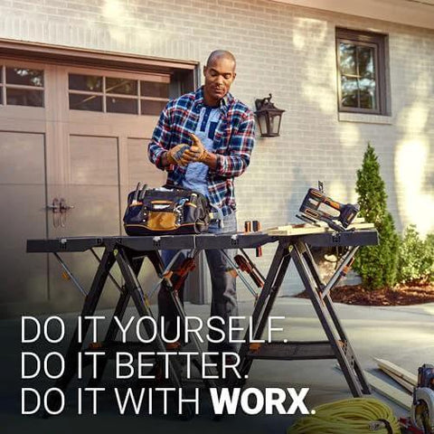 Man using Pegasus 2 In 1 Folding Work Table And Sawhorse Portable Workbench With Clamps WX051 outdoors, house background