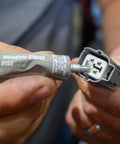 Applying Permatex 81150 Dielectric Tune-Up Grease, 0.33 oz. Tube, Silver to electrical connector for protection