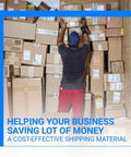 Warehouse worker organizing stacked shipping boxes