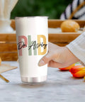 Hand holding Personalized 20 Oz PhD Tumbler For Women And Men, Doctor Of Philosophy Gift, Custom Doctoral Degree Cup with Nutrition Facts.