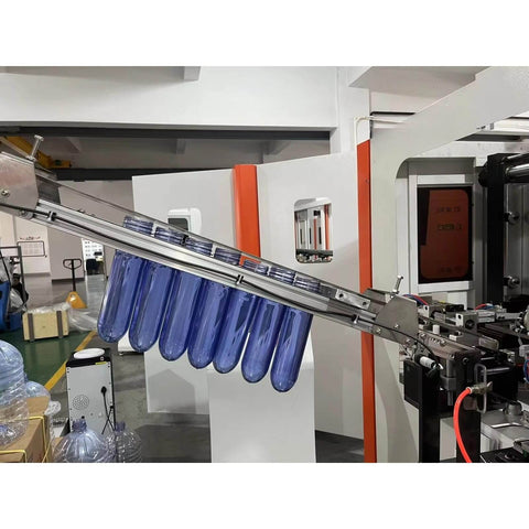 High Speed Automatic PET Bottle Blowing Machine With Adjustable Molds in operation at a beverage factory, featuring rugged equipment