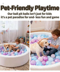 Child and dog in a ball pit, playing with Ball Pit Balls - 100pcs - Crush Proof Plastic Children's Toy Balls Macaron Ocean Balls for Birthday Parties.
