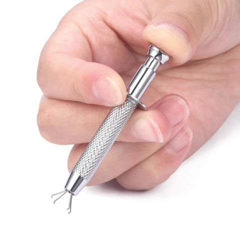 Person holding a stainless steel Piercing Jewelry Ball Grabber Tool For 16G Piercings With Screw On Replacement Balls Kit for easy jewelry changes.