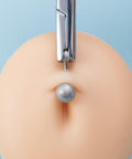 3mm Piercing Ball Removal Tool Stainless Steel Dermal Anchor Forceps in use on a simulated dermal top ball