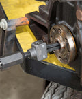 Pilot Bearing Puller Attachment For Slide Hammer installed, 2-Jaw Puller Pilot Bearing Removal Tool on machinery hub, side view