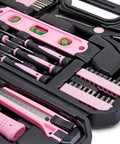 Close-up of Pink 142-Piece Household Tool Kit With Storage Case showing screwdrivers and level for home repairs and DIY projects
