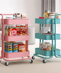 Two rolling carts with snacks and books displayed on three shelves, featuring 360-degree swivel wheels on a carpeted floor.