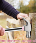 Lightweight 8oz hammer set with a small claw hammer and 25 mm rubber mallet in pink used on wooden fence