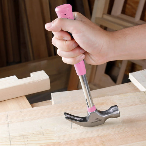 8 oz claw hammer with a shock-absorbing non-slip pink grip for comfortable, accurate nail driving and efficient nail removal in use.