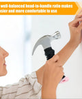 Person using a Pink 8 Oz Claw Hammer For Picture Hanging And Drywall Anchors With Shock Absorbing Non Slip Handle Lightweight Compact Design