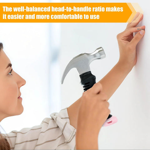 Person using a Pink 8 Oz Claw Hammer For Picture Hanging And Drywall Anchors With Shock Absorbing Non Slip Handle Lightweight Compact Design