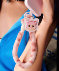 Crybaby Wild But Cutie Series Phone Charm Blind Box Wrist Strap Keychain for Phones in pink, shown attaching to a phone.