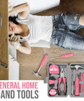 Pink Home Repair Tool Kit For Women Who DIY, 24 Piece Starter Hardware Set with hammer, pliers, screwdrivers visible in use