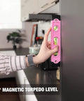 Using the pink 9-inch magnetic torpedo level from Pink 263-Piece Home Repair Tool Kit With Wide Mouth Storage Bag For DIY Projects