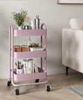 Pink 3 Tier Utility Rolling Cart On Wheels For Kitchen Office Home And Garden Elitehouse Metal Storage Cart With Locking Wheels Durable Mobile Organizer 13.4 By 18.1 By 31 Inches in living room setting