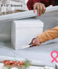 Close-up of a person using scissors from Pink 263-Piece Home Repair Tool Kit With Wide Mouth Storage Bag For DIY Projects And Breast Cancer Awareness Ribbon