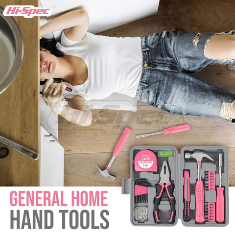 Woman using Pink 25 Piece Women DIY Tool Kit Set In Compact Mini Toolbox for home repair, includes various pink tools.