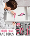 Man using screwdriver from Pink 24 Piece Diy Tool Kit For Women Compact Mini Tool Box Set in home repair