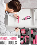 Man using pink screwdriver from Pink 13 Piece Tool Set For Women Portable Mini Toolkit For College Dorms Homes And Office Starter Toolbox