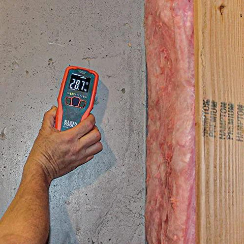 Person using Pinless Moisture Meter for Non-Destructive Moisture Detection in Drywall, Wood, and Masonry; Detects up to 3/4-Inch Below Surface on wall.