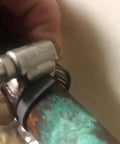 Close-up of Pipe Leak Repair Kit With 6 Patches And Stainless Steel Clamps, No Water Shut Off Needed installed on a pipe